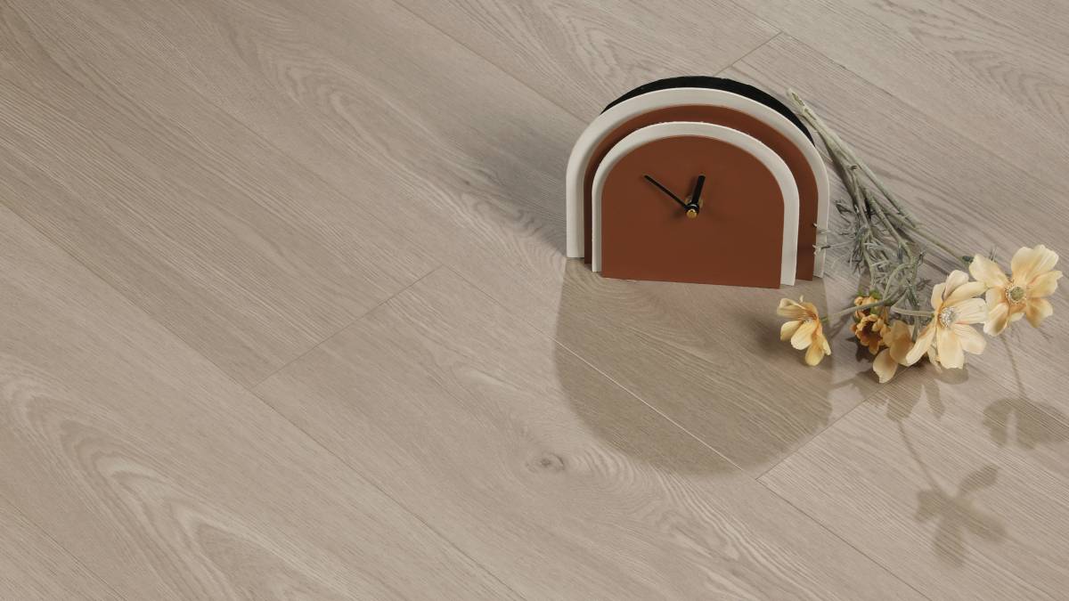 White Peaks AC5 laminate plank angle view showing 4-sided painted bevel and bright grain texture
