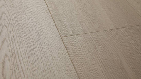 Mossy Stone AC5 laminate plank angle view showing 4-sided painted bevel and grey grain texture